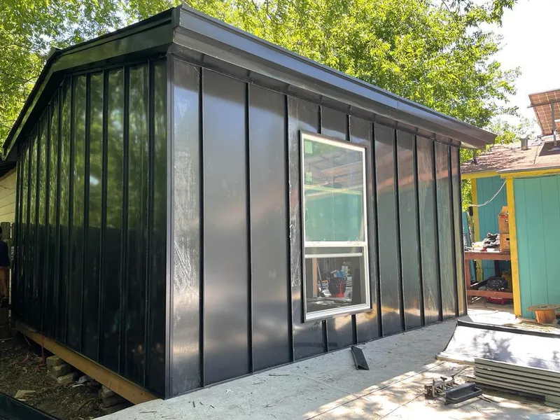 Black standing seam metal wall panels for Roof Inspection in Farmingdale