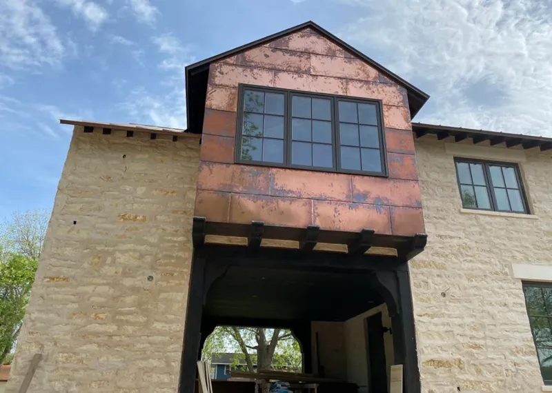Copper metal panel facade on a stone building for Skylight Installation in Farmingdale